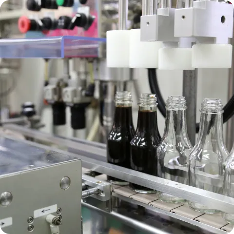 Seasonings being filled into bottles on the OEM production line