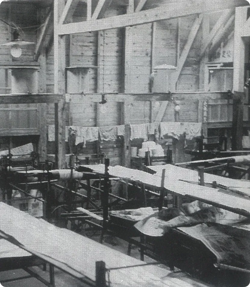 A black-and-white photo of the ASAHI SOGYO factory in its founding years